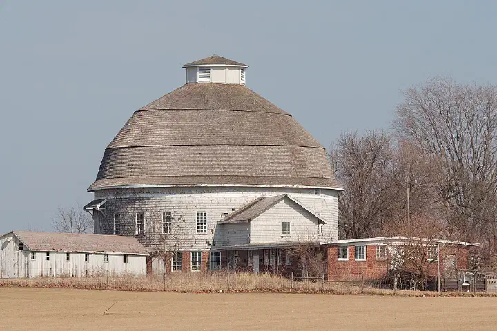 University of Illinois Experimental Dairy Farm Historic District, showing cow shed, and Barn #3 (built in 1912), Urbana, IL