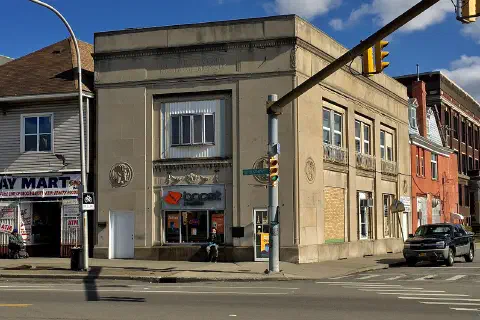 As seen in May 2020: it's just a lowly prepaid cell phone store now, but the building at 1067 Broadway (corner Sears Street) in Buffalo