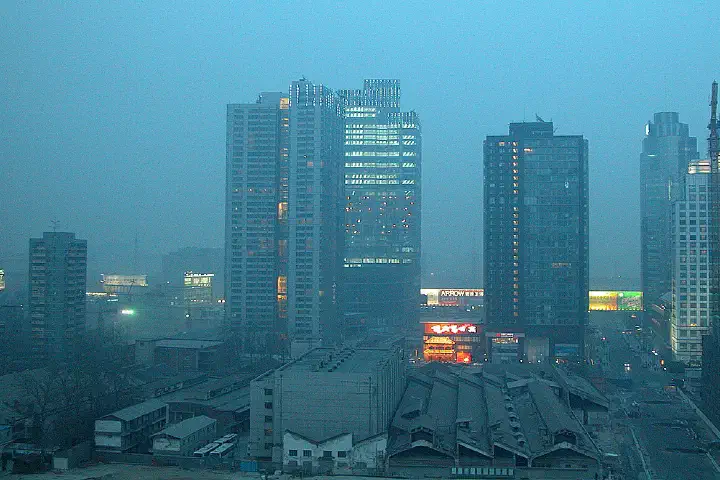 Beijing, in the thick of a hot, gritty sand storm, brought about because of desertification of the land to the north-west.Grit