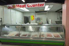 The meat counter at a Honeybee supermarket on El Socorro Road, San Juan, Trinidad.