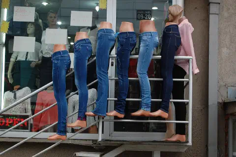 Denim jeans on mannequin legs, outside a clothes shop on Agim Ramadani Street, Pristina, Kosovo