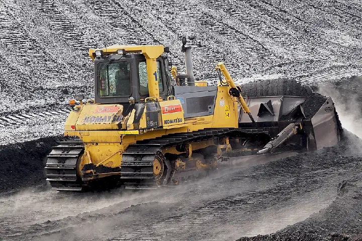 Komatsu bulldozer (D85 PX; semi-U tilt dozer) pushing Indonesian coal in Power plant Ljubljana