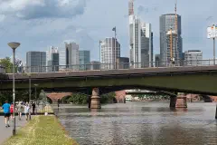 The southern end of the Ignatz Bubis Bridge in Frankfurt am Main, with the skyline behind.