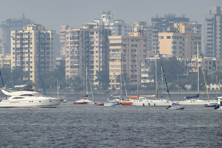Skyline of Mumbai overseeing Sail boats, captured from Bay of Bengal