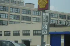 A sign showing gas prices.