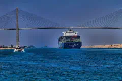 Container ship CMA CGM Thalassa passing the Suez Canal Bridge