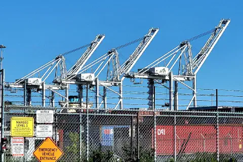 Three container cranes at the Port of Oakland, California