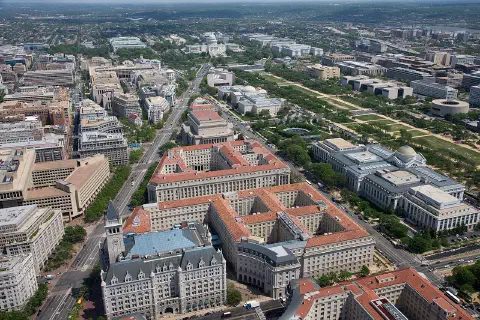 Aerial view of Pennsylvania Avenue (left) and the Federal Triangle (center), facing east towards the United States Capitol in Washington