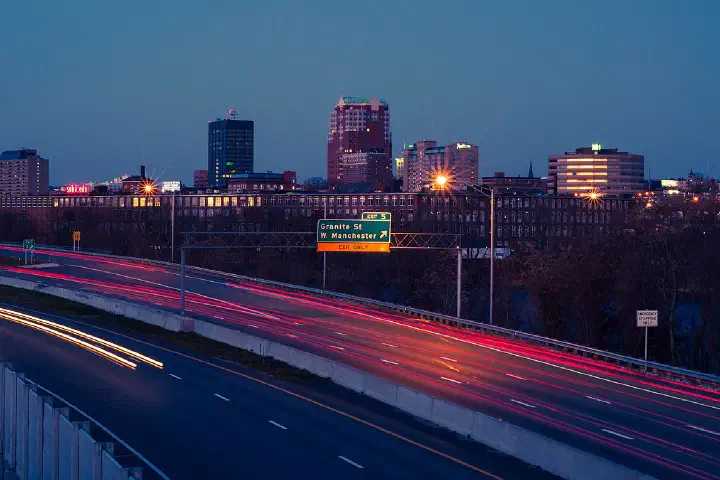 Manchester skyline at night viewed from I-293