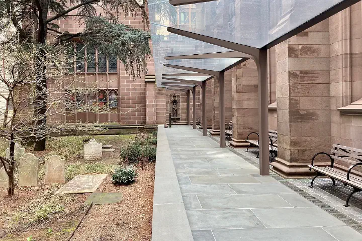 Modern steel and glass canopy on the south terrace of Trinity Church Wall Street, Manhattan, New York, designed by MBB Architects