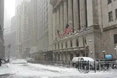 Broad Street at Wall Street, in front of the New York Stock Exchange, during a snowstorm on February 9, 2017.