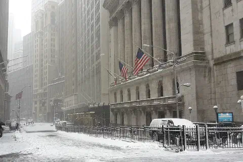 Broad St at Wall St, in front of New York Stock Exchange, during a snowstorm on February 9, 2017
